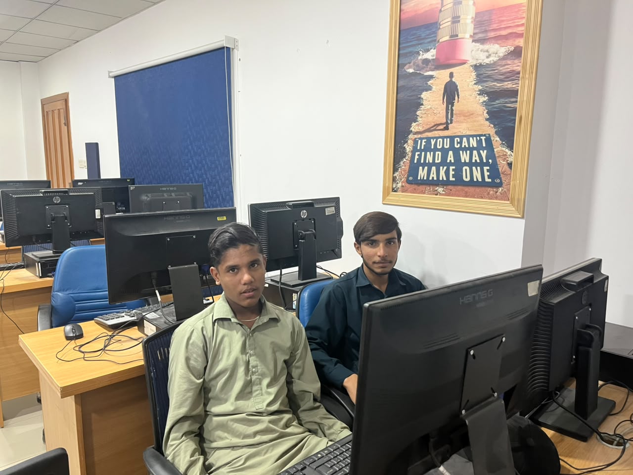 Two learners at their workstations