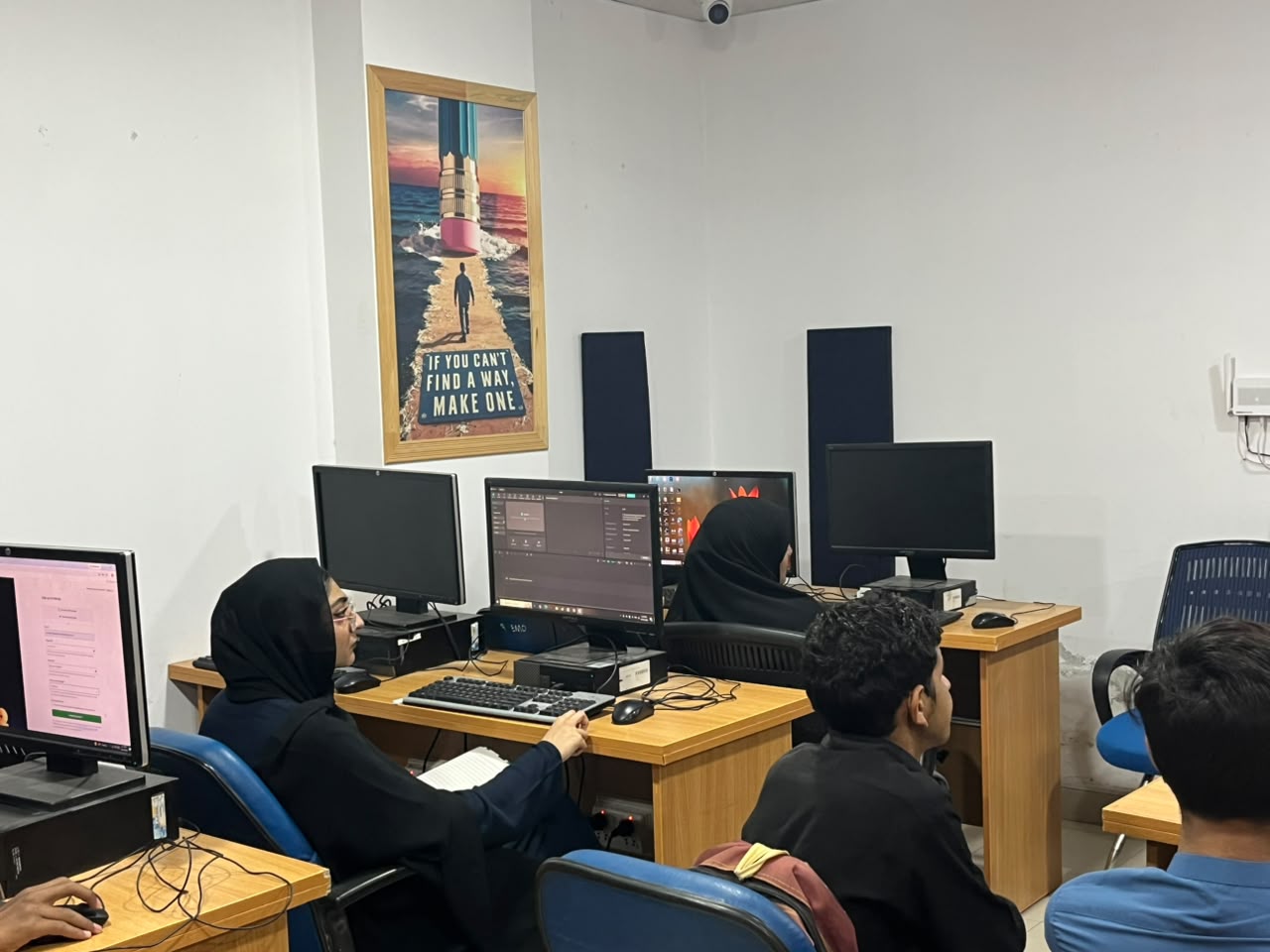 Learners working on computers during a class