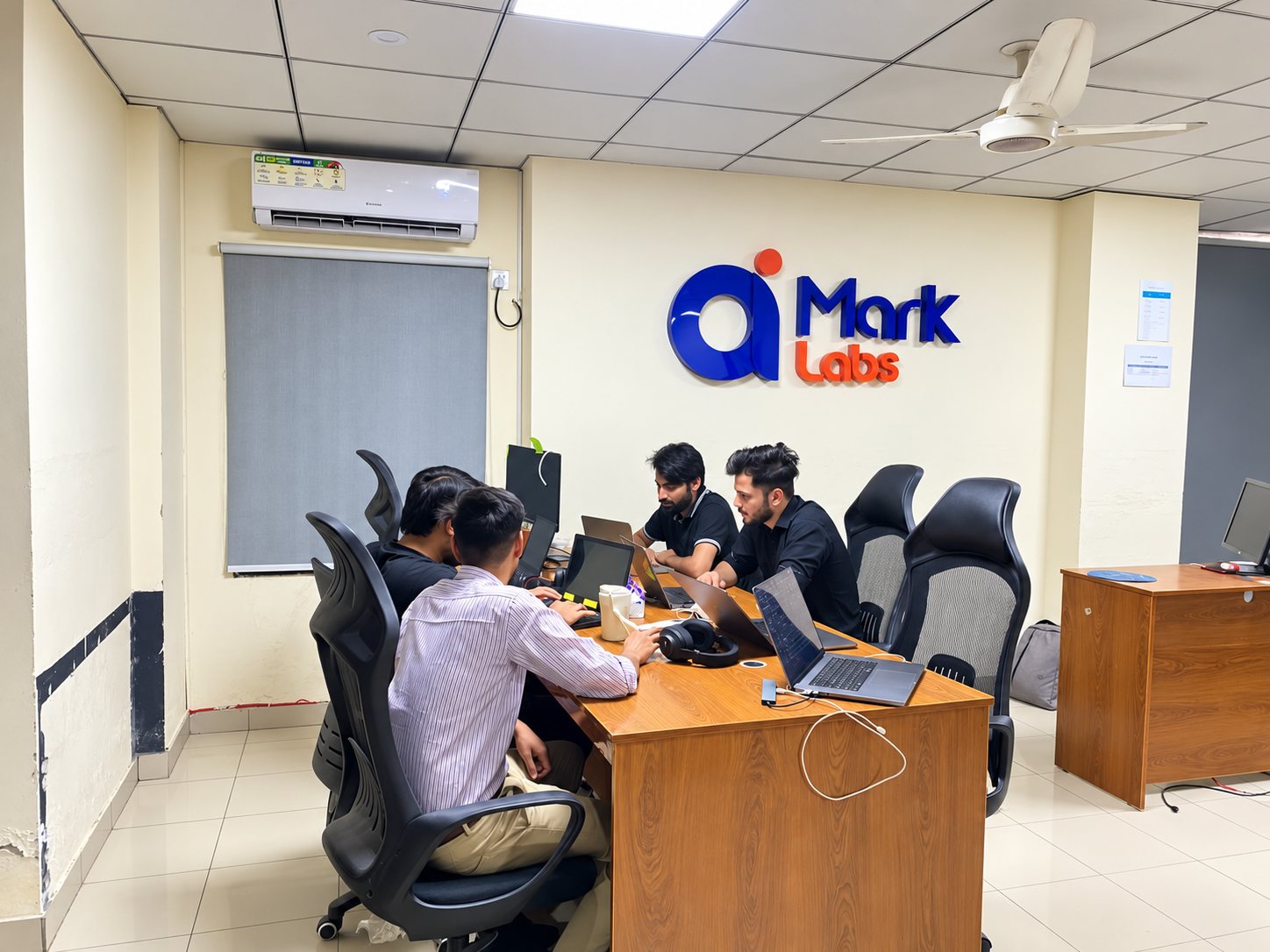 The AI Mark Labs team working at the office